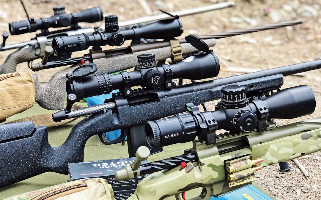 Scope Lineup Four scopes mounted to rifles
